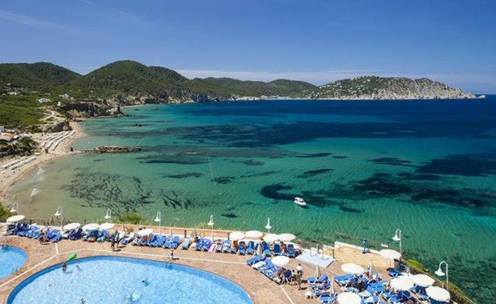 Cala Llonga beach and pool, Ibiza. Car and scooter rental