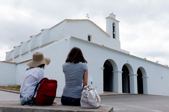 Tourists admiring the church of Sant Josep de sa Talaia, Ibiza